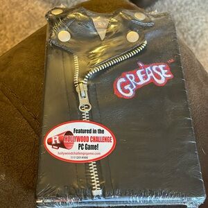 NIP GREASE DVD, packed in faux leathered, zipped jacket cover.